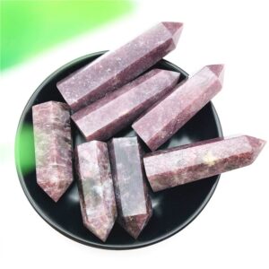 Lepidolite healing stones for forgiveness in obelisk shapes.