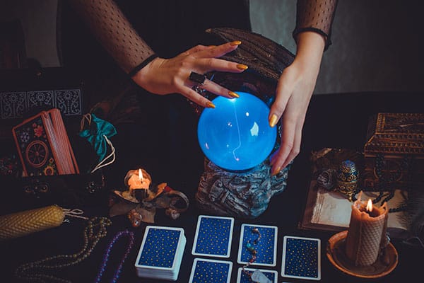 crystal ball, tarot cards, and other divination tools