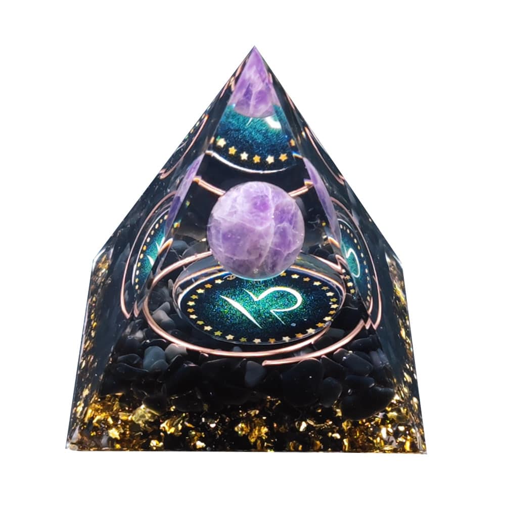 This Libra Orgonite Pyramid measures 50mm x 50mm x 50mm and is made from black obsidian, an amethyst sphere, gold foil, copper, resin, and love.