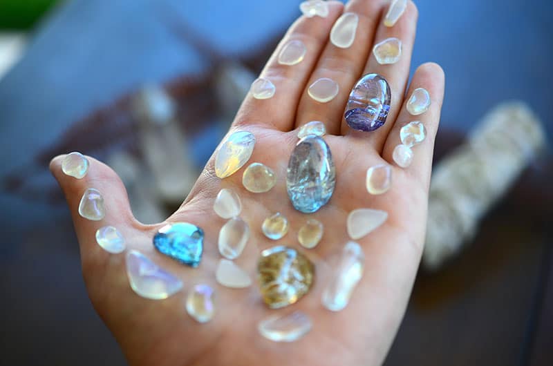 Crystal enthusiast with a crystal grid on their hand.