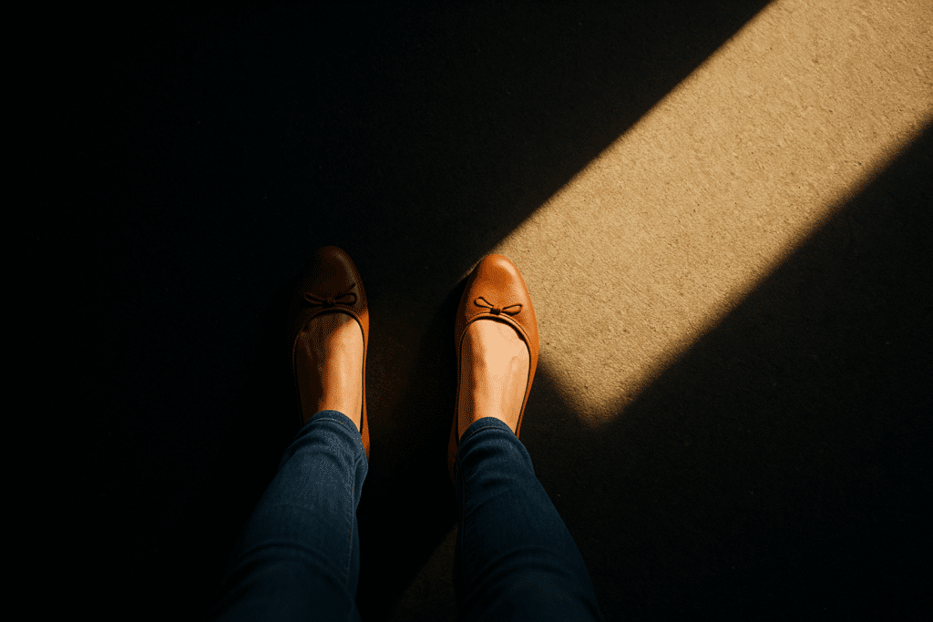 A woman hiding in the shadows, avoiding her own power and agency.